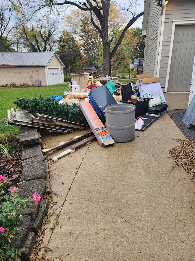 Dumpster being loaded with debris for Residential Dumpster Rental in Euclid